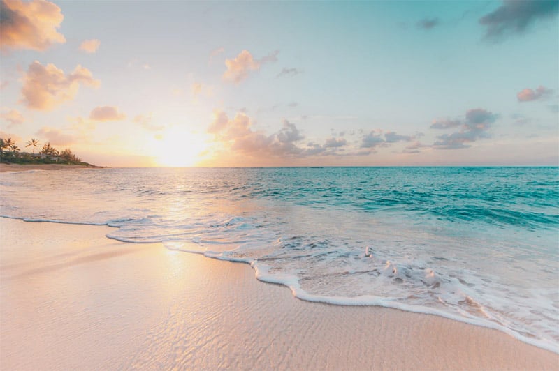 Summer background - beautiful beach at sunset