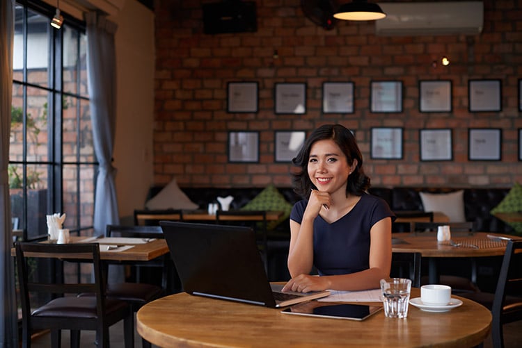 Female freelancer sitting at a table